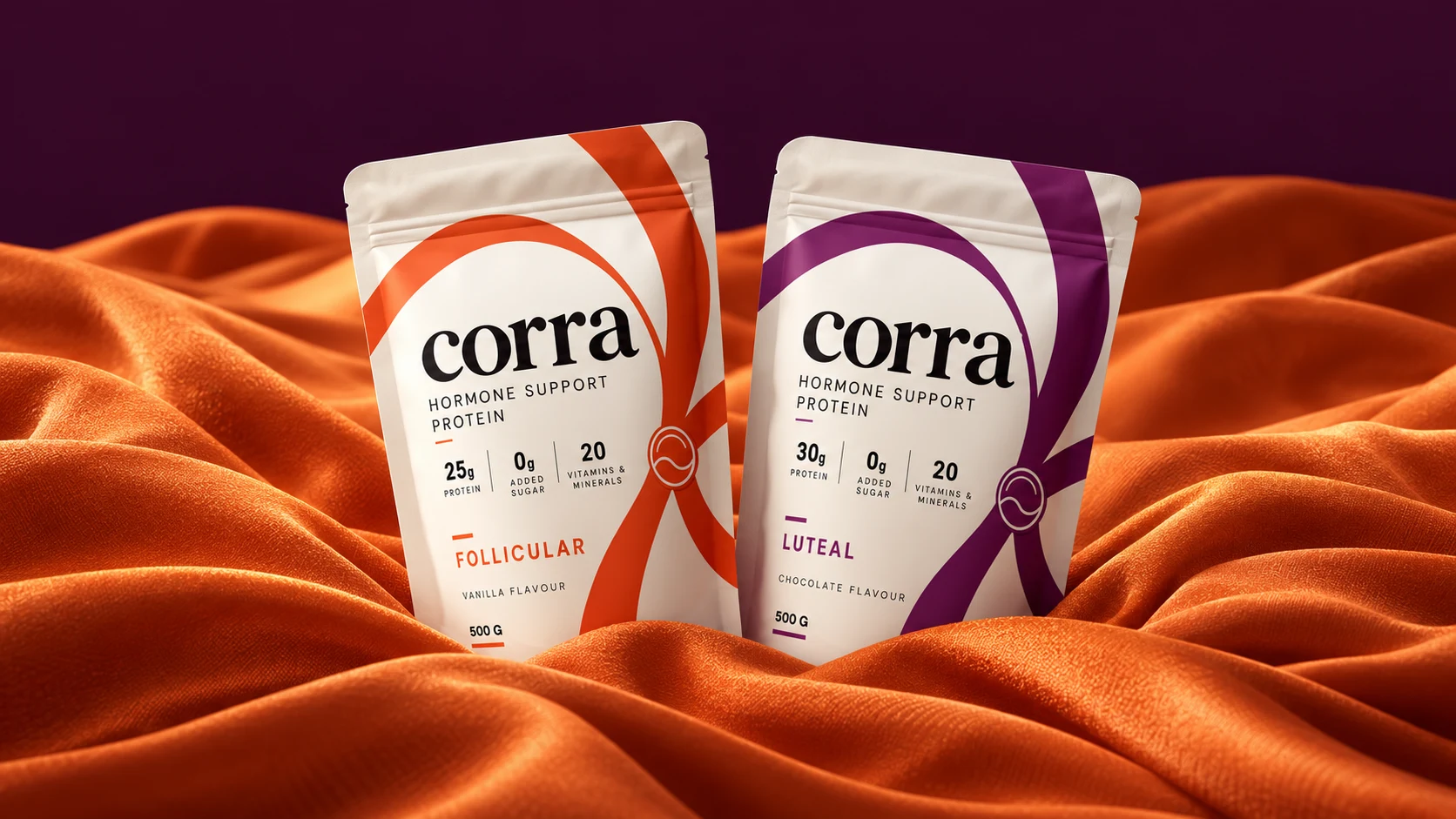 The two Corra protein pouches in a sculptural orange and plum landscape